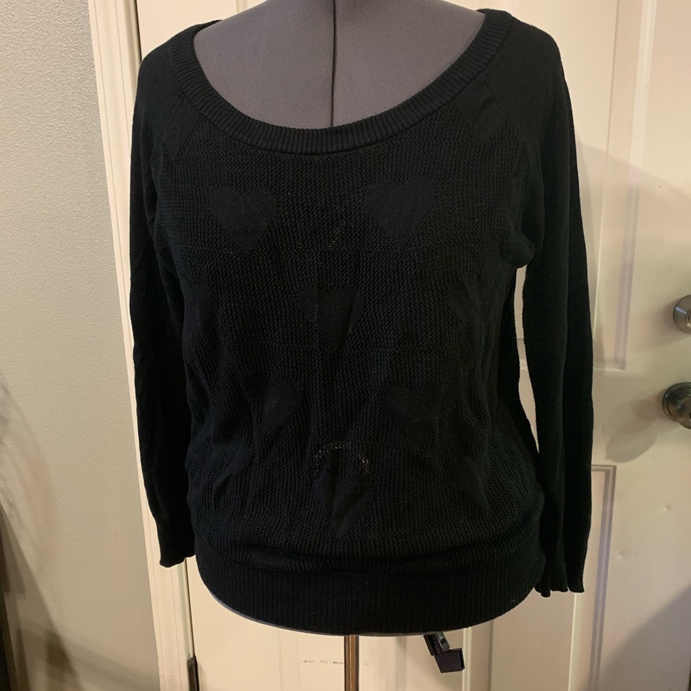 Knit sweater with heart details.